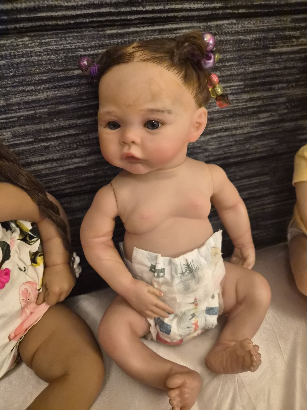 Reborn Baby Doll with Brown Hair and Pink Hair Beads